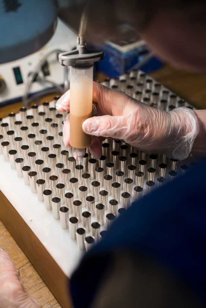 Image showing paintbrush fibres being set into place using a glue.
