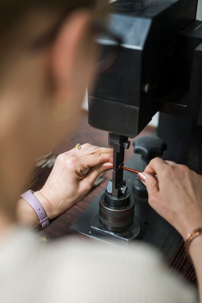 Image of a paintbrush making performing a technique called clenching using a machine