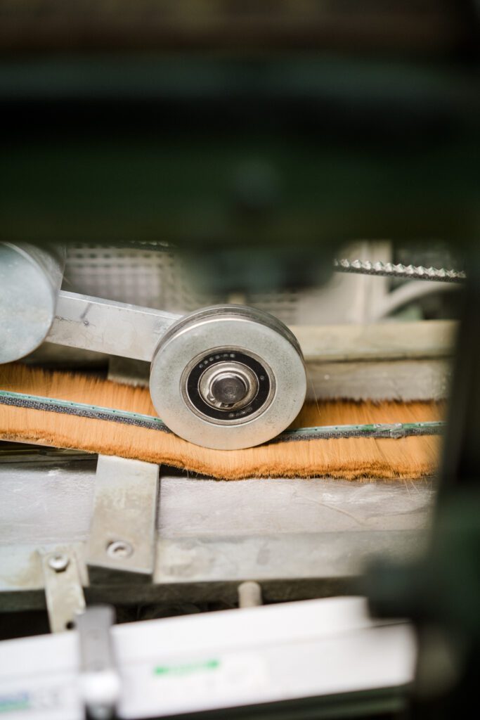 Image of a machine used to bundle paintbrush hair together.