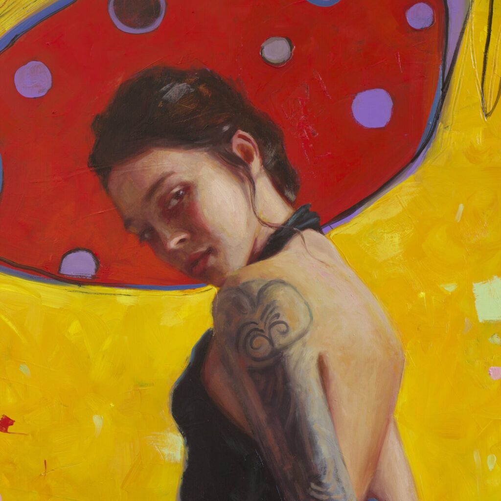 Painting of a woman with dark hair tied back, wearing a black halter top. She is turned slightly to the side, showcasing a detailed tattoo on her upper arm. The background features vibrant yellow tones and a red shape resembling butterfly wings with purple polka dots, adding a whimsical, bold contrast to the portrait.